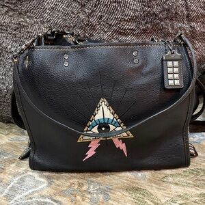 Coach Black glovetanned pebbled leather pyramid eye rogue 30 handbag